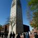 Masters level and PHD students file past the Burton Memorial Tower as they walk over to Hill Auditorium for commencement on Friday morning. Melanie Maxwell I AnnArbor.com